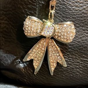 NWT Bow purse charm/keychain with clear rhinestones. It sparkles!